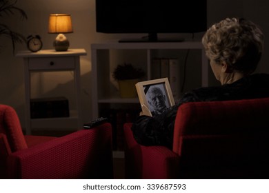 Elderly Widow Thinking About Her Dead Husband 