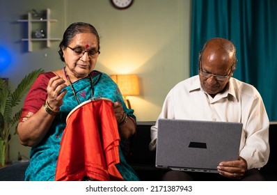 Elderly Wife Busy Working On Embroidery While Husband Working On Laptop At Home - Concept Of Family Lifestyle, Home Improvement And Togetherness