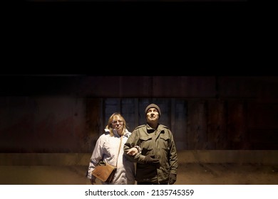 Elderly Wife And Husband Standing Together In A Nuclear Shelter