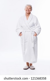 Elderly Woman In A Bathrobe On A White Background