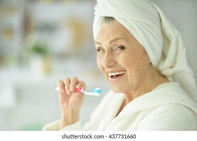 Elderly Woman Brushing Her Teeth 