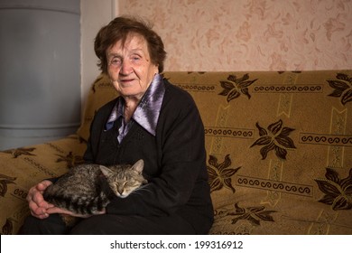 An elderly woman with cat.