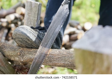 Elderly Woman Chopping Firewood