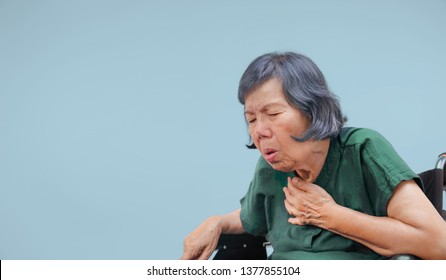 elderly woman cough ,choke on wheelchair - Powered by Shutterstock