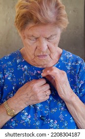 Elderly Woman Disabled Woman Getting Dressed. Apraxia. Loneliness In Old Age