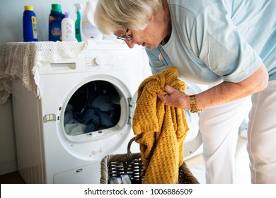 Elderly Woman Doing A Laundry