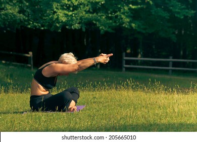 elderly woman doing yoga