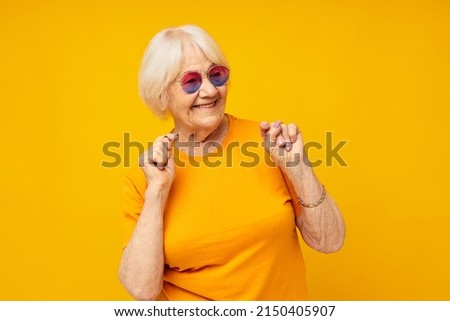 elderly woman in fashionable glasses isolated background