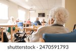 Elderly woman with foldable walker in nursing home