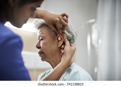 An Elderly Woman With Hearing Aid