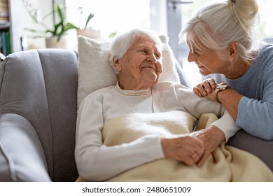 Elderly woman with her caregiver at nursing home
 - Powered by Shutterstock