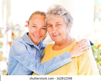 Elderly Woman And Her Daughter Enjoying Themselves