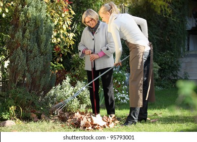 Elderly woman with her gardener - Powered by Shutterstock