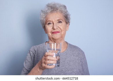 Elderly Woman Holding Glass Water On Stock Photo 664512718 | Shutterstock