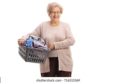 Elderly Woman Holding A Laundry Basket Filled With Clothes Isolated On White Background