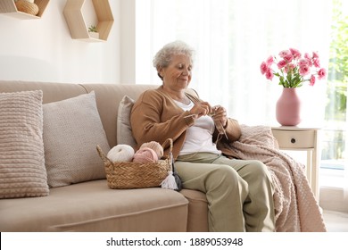 Elderly woman knitting at home. Creative hobby - Powered by Shutterstock