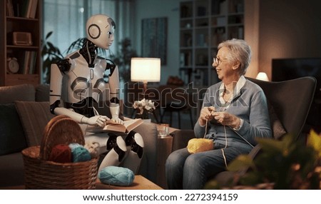 Elderly woman knitting on a sofa with her companion android reading a book in the living room. Concept of elderly care and future.