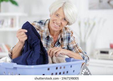 Elderly Woman With Laundry Basket