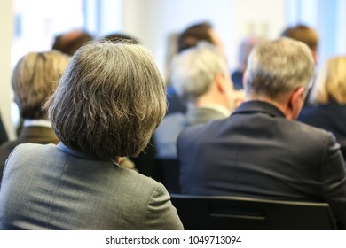 An Elderly Woman Listening To A Panel Discussion At A Networking Event In Washington, D.C. 