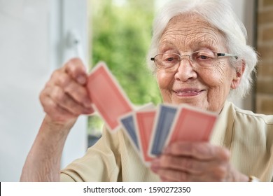 Elderly Woman In The Living Room, Playing Cards