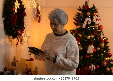 Elderly woman and lonely moments in Christmas day - Powered by Shutterstock