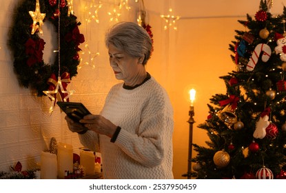 Elderly woman and lonely moments in Christmas day - Powered by Shutterstock