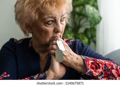 Elderly Woman With A Military Dog Tag