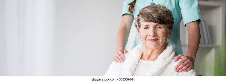 Elderly Woman In Nursing Home And Nurse