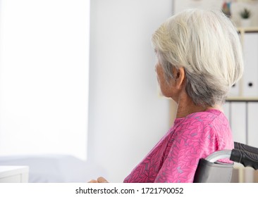 Elderly  Woman Patient  On Wheelchair Waiting Doctor In Hospital