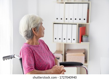 Elderly Woman Patient On Wheelchair Waiting Doctor In Hospital