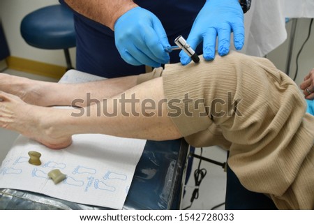Elderly woman patient at podiatrist
