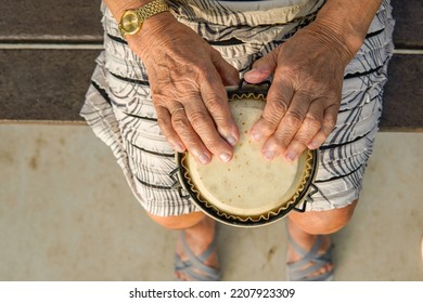 Elderly Woman Playing Music. Musical Therapy.