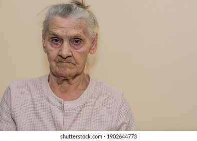 Elderly Woman Portrait Isolated On Light Background