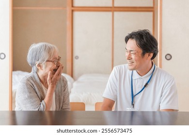 Elderly woman receiving home care (smile) - Powered by Shutterstock