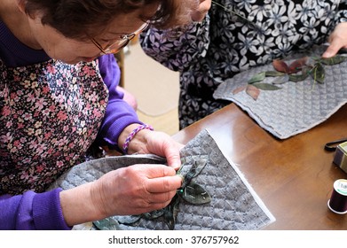 elderly woman with a sewing, Japanese