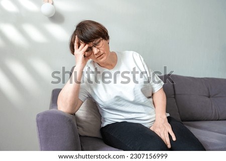 Similar – Image, Stock Photo Senior woman suffering from chest pain while her husband comforting her