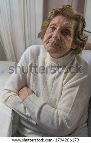 Similar – Image, Stock Photo Senior woman in a wheelchair alone in a room
