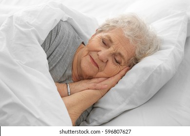 Elderly Woman Sleeping In Bed