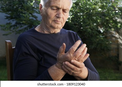 Elderly Woman Suffering From Hand Pain. Arthritis Symptoms.