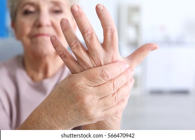 Elderly Woman Suffering From Pain In Hand, Closeup