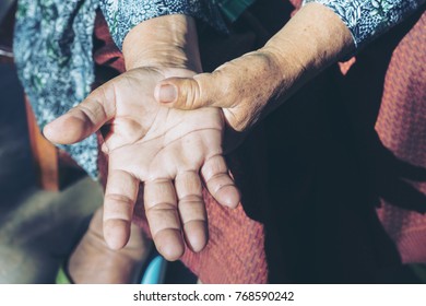 Elderly Woman Suffering From Pain In Hand.selective Focus