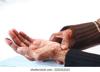 Elderly woman suffering from pain isolated on white. - Shutterstock ID 2231312215