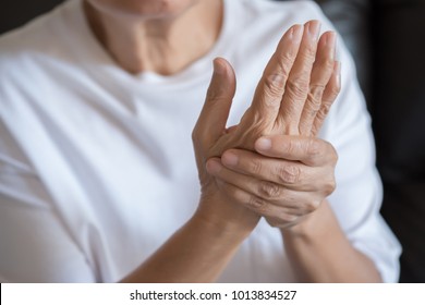 Elderly woman suffering from pain From Rheumatoid Arthritis