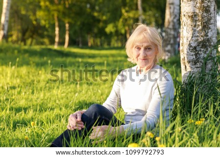 Similar – Smiling senior woman in wheelchair