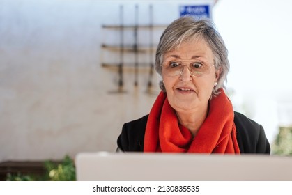 Elderly Woman Surprised To See Her Laptop