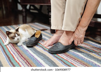 Elderly Woman Swollen Feet Putting On Shoes