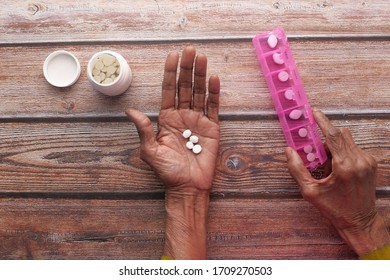 Elderly Woman Taking Medicine From Pill Box 