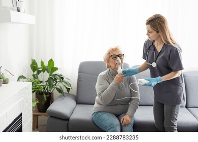 Elderly woman using inhaler for asthma and respiratory diseases at home