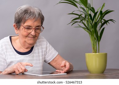 Elderly Woman Using A Tablet