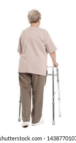 Elderly Woman Using Walking Frame Isolated On White, Back View